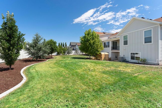 View of fenced backyard | Image 32