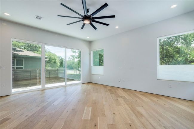 Unfurnished room featuring a ceiling fan, hardwood / wood-style floors, and recessed lighting | Image 4