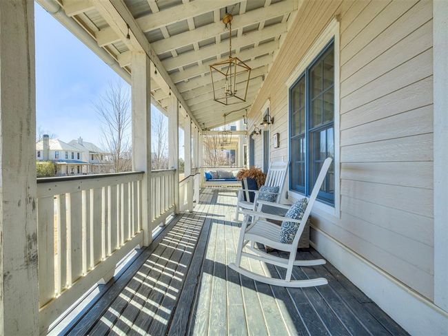 Wooden terrace featuring covered porch | Image 35