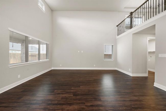 The view of the living room from the kitchen. | Image 7
