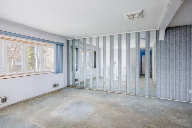 Unfurnished room featuring visible vents | Image 9