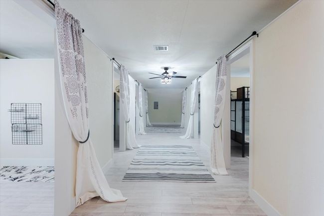 Building 1 is complete with multiple bathrooms and removable walls that currently provide 8 different bedrooms. | Image 25