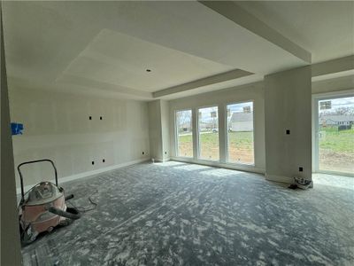 Carpeted spare room featuring a raised ceiling | Image 3