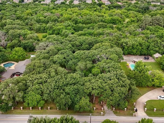 Aerial view of a heavily wooded area | Image 7