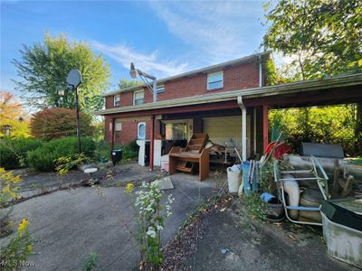 Back of house with a carport and a garage | Image 3