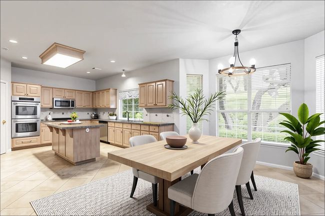 Dining area featuring light tile patterned floors, a chandelier, baseboards, and recessed lighting | Image 6