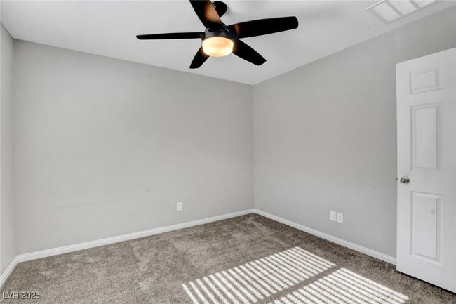 Carpeted empty room featuring baseboards and ceiling fan | Image 35