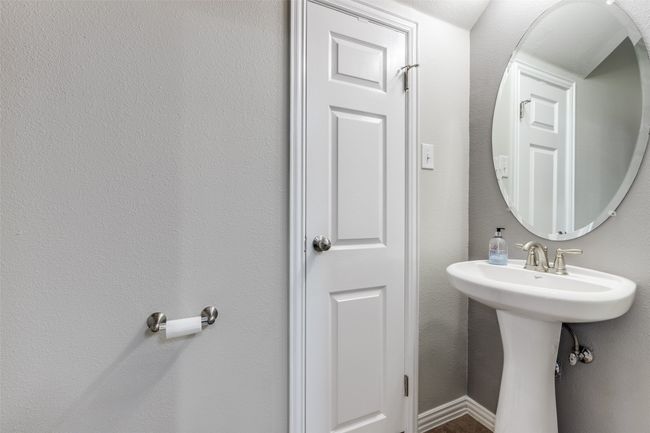 Powder room with linen closet downstairs | Image 17