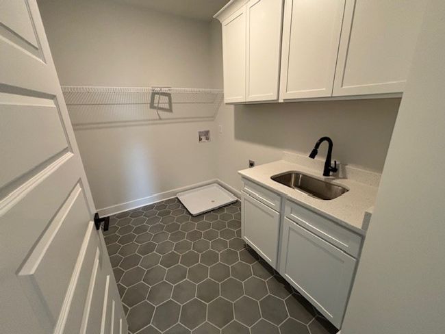 Laundry room with sink for items that need hand washing. | Image 17
