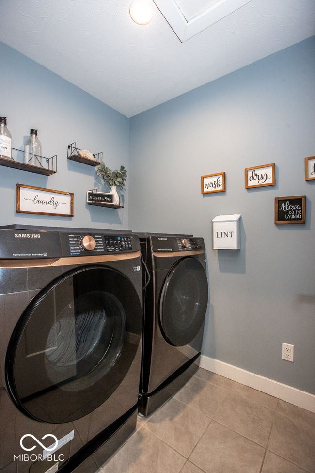 Spacious and conveniently located upstairs laundry room | Image 24