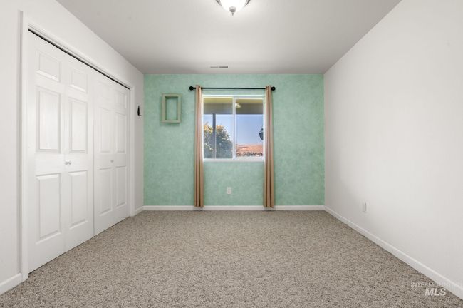 3rd bedroom on lower level with carpet and a closet | Image 34