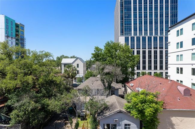 Northern-facing terrace captures tree-top views. | Image 8
