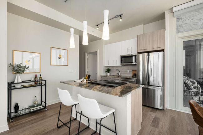 The island truly is the heart of this home, perfectly positioned for entertaining, gathering, and cooking with a view. | Image 18