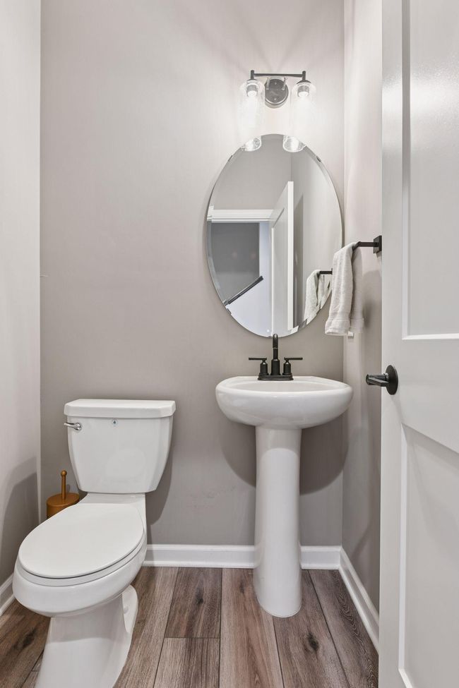 The Powder Room is located just off the foyer. | Image 7