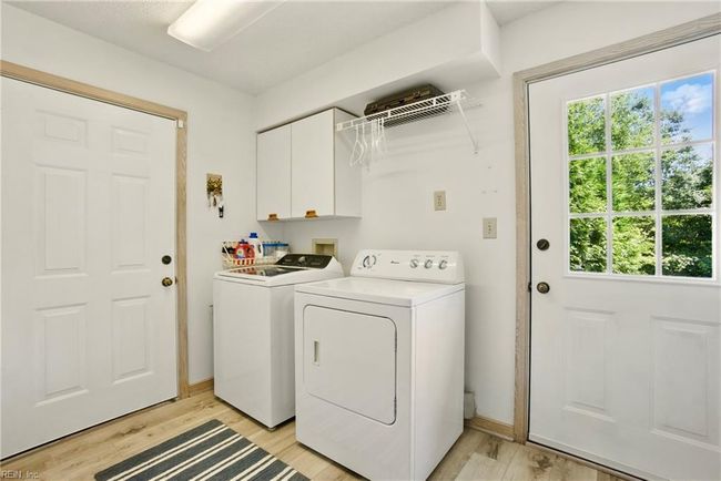 Laundry Room with entrance to the attached two car garage | Image 38