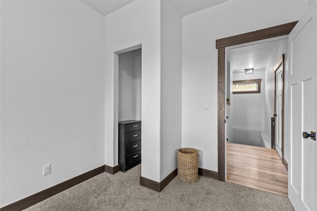 Unfurnished bedroom featuring baseboards and carpet | Image 41