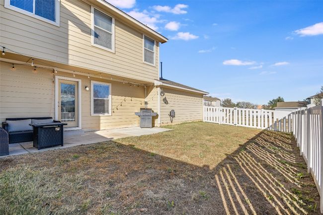 Fenced backyard featuring a patio area | Image 19