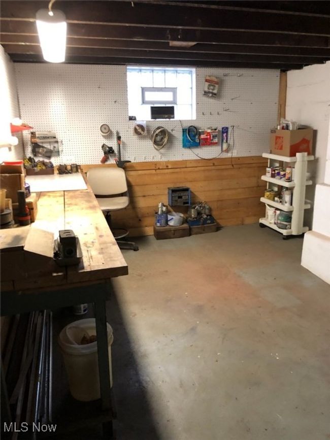 Basement featuring a workshop area | Image 32