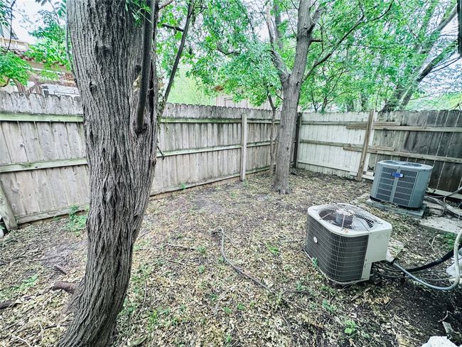 View of fenced backyard | Image 16