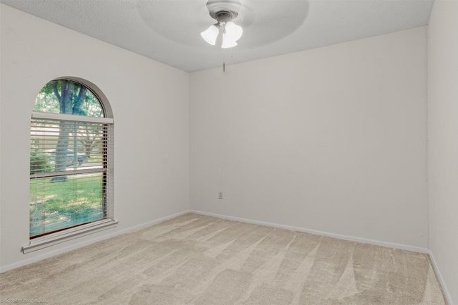 Spare room featuring ceiling fan, light colored carpet, and baseboards | Image 21