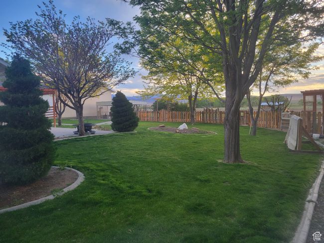 View of yard featuring fence | Image 49