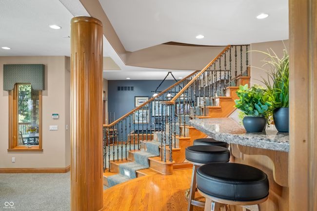 stairs with ornate columns, visible vents, recessed lighting, and baseboards | Image 60