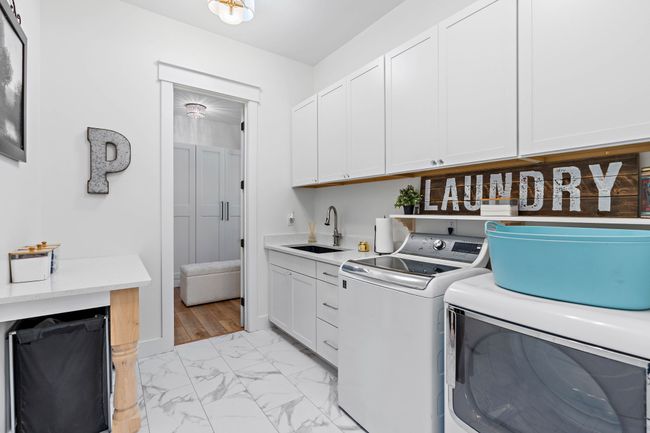 Laundry can be accessed via hallway or primary closet | Image 27