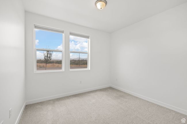 Unfurnished room featuring light carpet and baseboards | Image 25