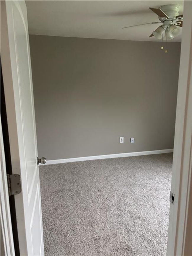 Empty room with baseboards, a ceiling fan, and carpet flooring | Image 15