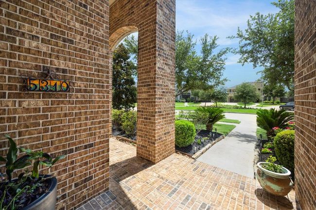 A picturesque 2 story front porch is the perfect spot to grab your morning cup of coffee or tea. | Image 7