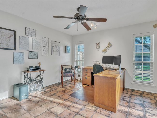 Office space with ceiling fan and baseboards | Image 19