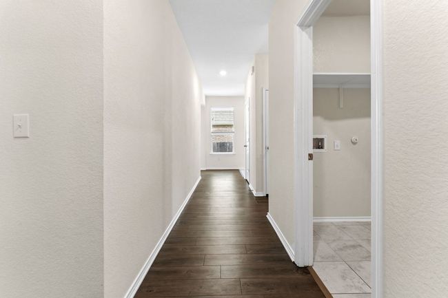 Hallway with dark wood-style flooring and recessed lighting | Image 25