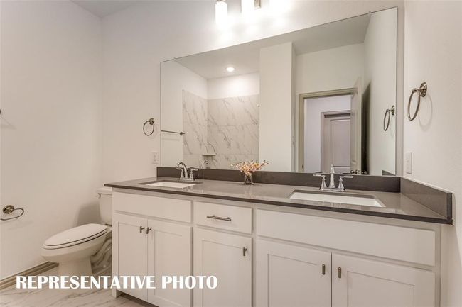 Guests will feel right at home in this beautifully finished guest bath. REPRESENTATIVE PHOTO | Image 16