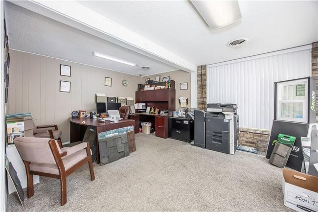 Office area featuring visible vents, carpet floors, a textured ceiling, and beamed ceiling | Image 23