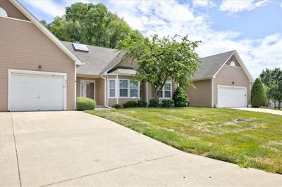 View of front of property featuring a garage and a front lawn | Image 2