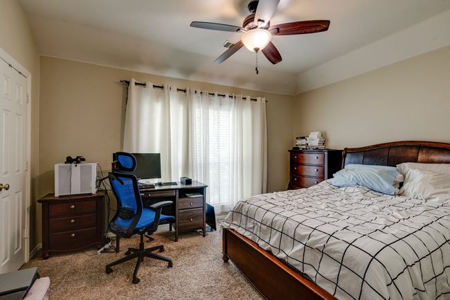 Bedroom with carpet flooring and a ceiling fan | Image 28