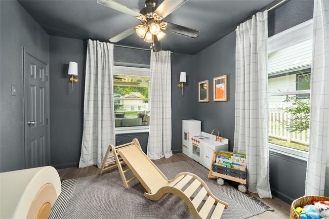 Bonus room/office on the main floor with a step in closet and sliding doors. | Image 6