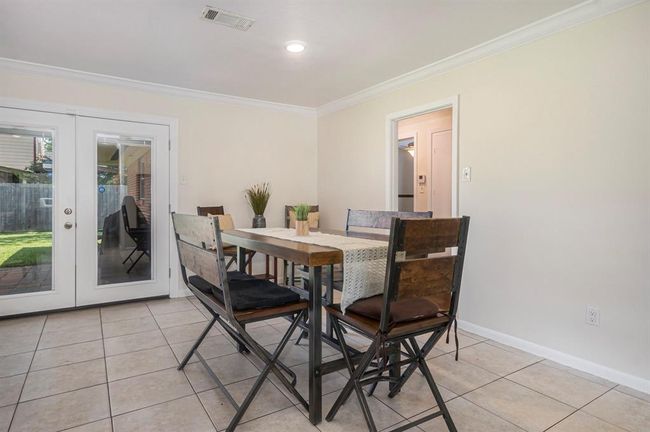 The eat-in kitchen is big enough for a large table, and offers a beautiful view of the backyard. | Image 13