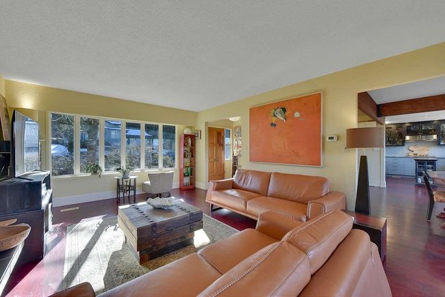 Living room featuring wood finished floors and a textured ceiling | Image 6