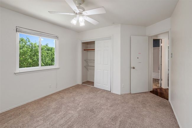 Unfurnished bedroom featuring a closet, carpet flooring, ceiling fan, and baseboards | Image 21