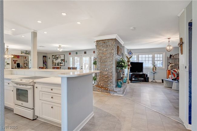 Kitchen featuring electric stove, open floor plan, white cabinetry, recessed lighting, and light countertops | Image 52