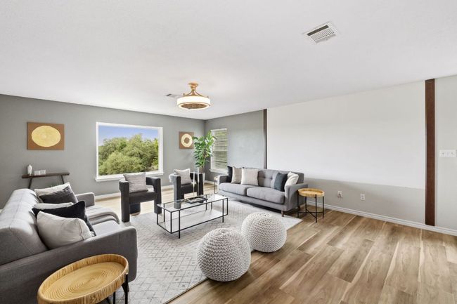 Living area with wood finished floors and baseboards | Image 23