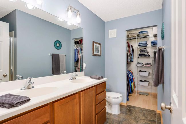 Owner's bath with dual sink vanity and ceramic tile flooring | Image 18