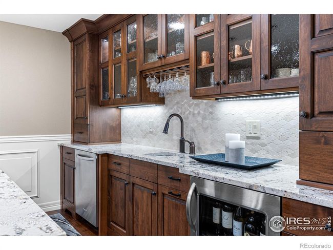 Lower Level Kitchen Bar with Microwave, Sink, Dishwasher and Refrigerator. Lots of Cabinet Storage Space. | Image 26