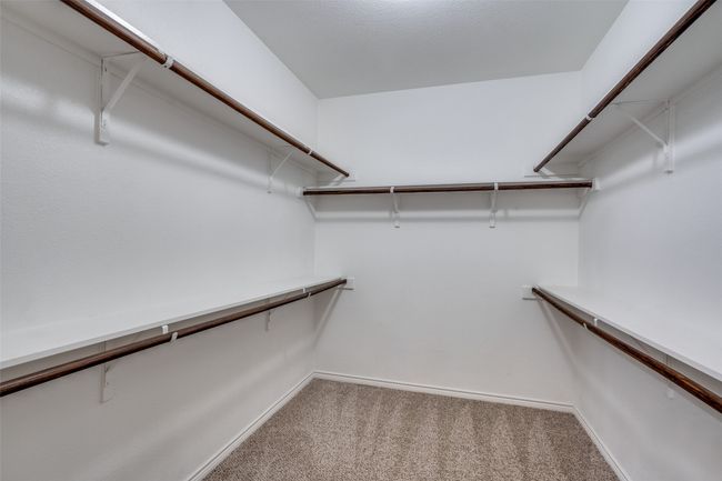 Walk in closet with carpet flooring | Image 15