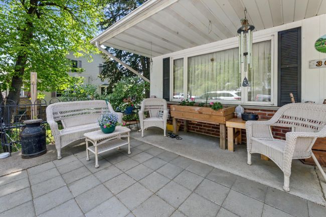 Main Level Patio with a gated dog run. | Image 5