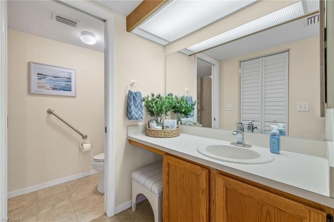 Bathroom with vanity, tile patterned flooring, and toilet | Image 15