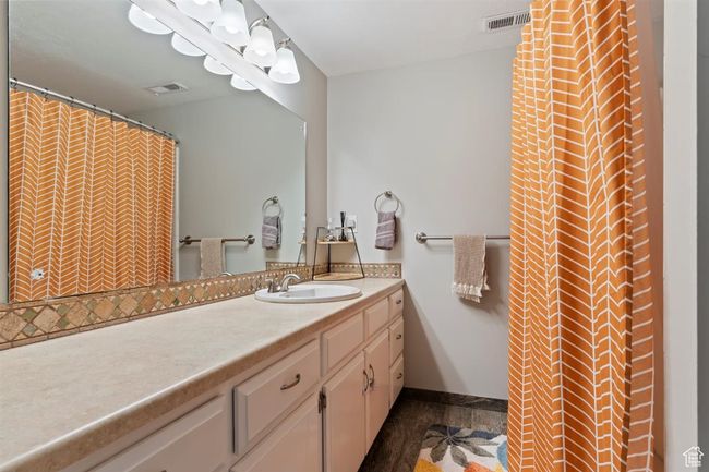 Bathroom featuring vanity and baseboards | Image 26