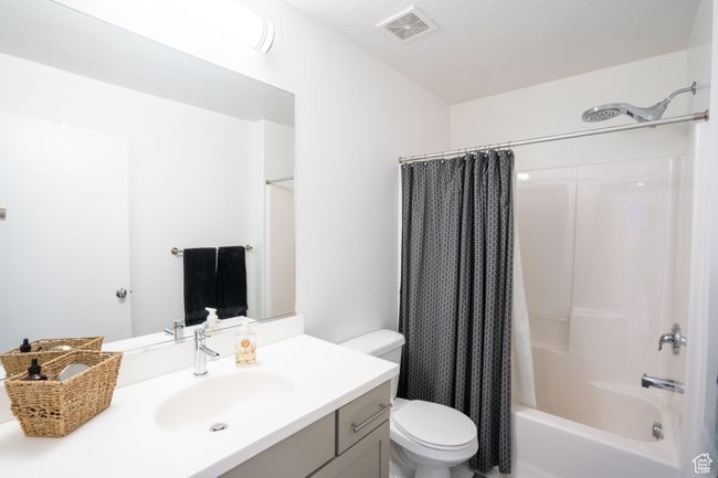 Full bathroom featuring vanity and shower/tub combo | Image 27