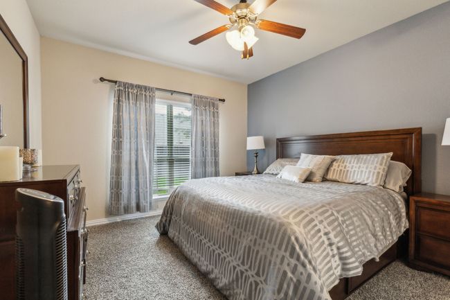 Carpeted bedroom featuring baseboards and ceiling fan | Image 12